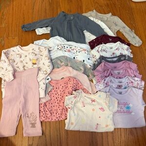 Bundle of 0-3 month onesies and zip up pajamas